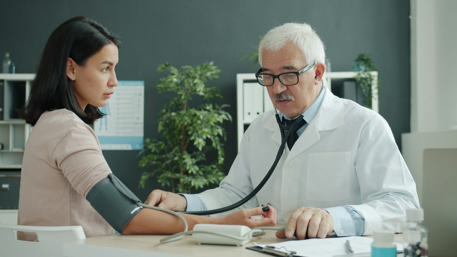 Clinician speaking with a patient during a drug testing appointment at a clinic in Kuala Lumpur