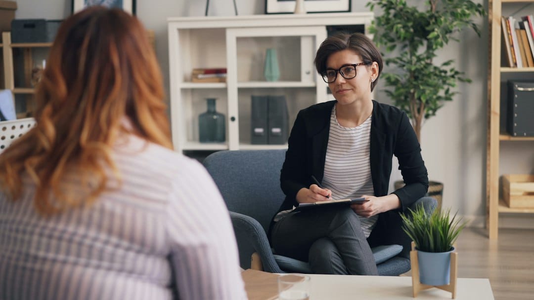 Clinical psychologist speaking with a patient during a pre-surgical psychological assessment in Kuala Lumpur