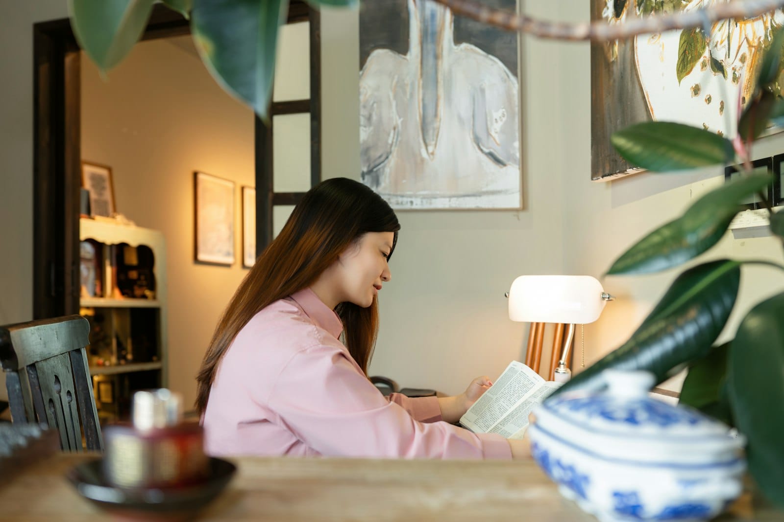Woman reading at home as she prepares for her pre-surgical psychological evaluation